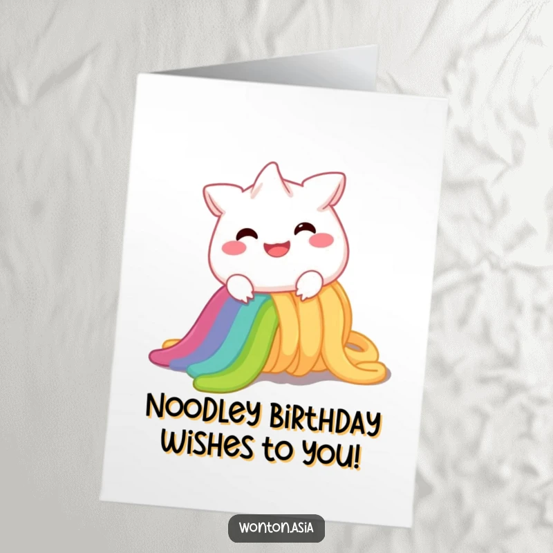 Funny free printable birthday card featuring a happy wonton character sliding down a vibrant rainbow noodle with a huge smile.